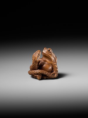 Lot 121 - HARUMITSU: A SUPERB WOOD NETSUKE OF A SNAKE PREYING ON A FROG, SANSUKUMI