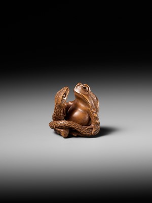 Lot 121 - HARUMITSU: A SUPERB WOOD NETSUKE OF A SNAKE PREYING ON A FROG, SANSUKUMI