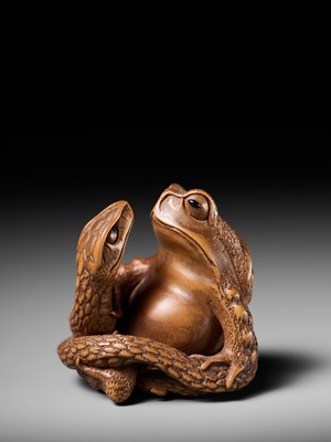 Lot 121 - HARUMITSU: A SUPERB WOOD NETSUKE OF A SNAKE PREYING ON A FROG, SANSUKUMI