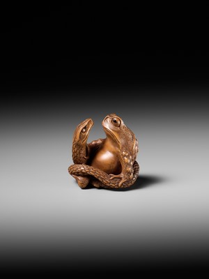 Lot 121 - HARUMITSU: A SUPERB WOOD NETSUKE OF A SNAKE PREYING ON A FROG, SANSUKUMI