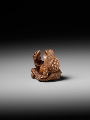 Lot 121 - HARUMITSU: A SUPERB WOOD NETSUKE OF A SNAKE PREYING ON A FROG, SANSUKUMI