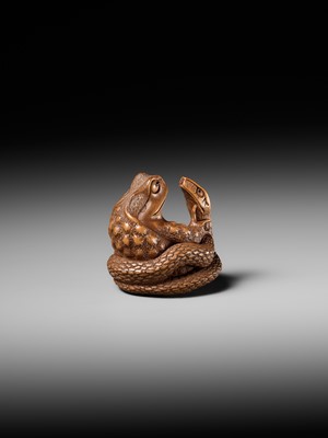 Lot 121 - HARUMITSU: A SUPERB WOOD NETSUKE OF A SNAKE PREYING ON A FROG, SANSUKUMI