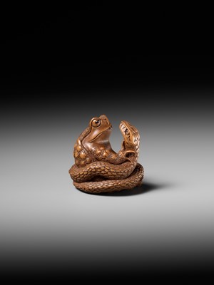 Lot 121 - HARUMITSU: A SUPERB WOOD NETSUKE OF A SNAKE PREYING ON A FROG, SANSUKUMI