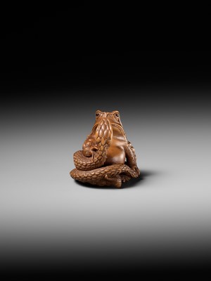 Lot 121 - HARUMITSU: A SUPERB WOOD NETSUKE OF A SNAKE PREYING ON A FROG, SANSUKUMI