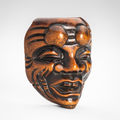 Lot 1803 - A WOOD NETSUKE MASK OF OKINA (KOKUSHIKI-JO)