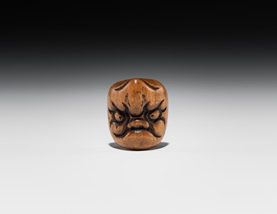 Lot 546 - A WOOD ‘DOUBLE MASK’ NETSUKE OF KARASU TENGU TYPE