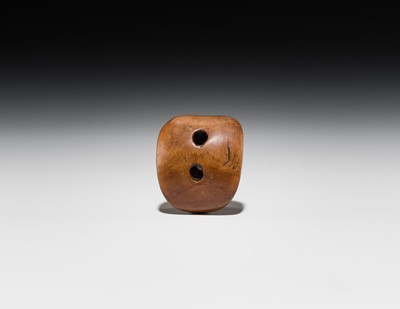 Lot 546 - A WOOD ‘DOUBLE MASK’ NETSUKE OF KARASU TENGU TYPE