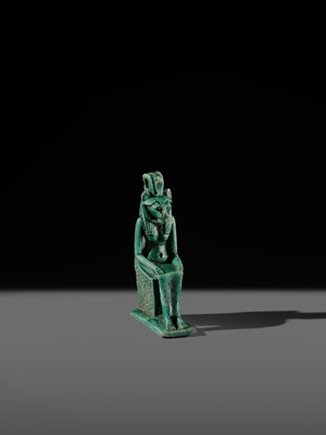 A TURQUOISE-GLAZED FAIENCE AMULET OF THE ENTHRONED SEKHMET, LATE PERIOD, DYNASTY XXVI (SAITE)