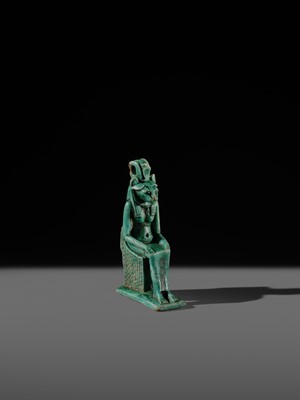 A TURQUOISE-GLAZED FAIENCE AMULET OF THE ENTHRONED SEKHMET, LATE PERIOD, DYNASTY XXVI (SAITE)