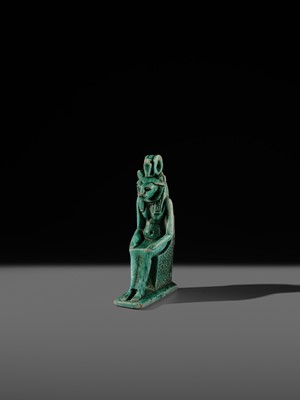A TURQUOISE-GLAZED FAIENCE AMULET OF THE ENTHRONED SEKHMET, LATE PERIOD, DYNASTY XXVI (SAITE)