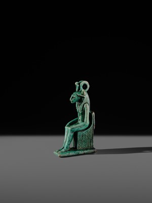 A TURQUOISE-GLAZED FAIENCE AMULET OF THE ENTHRONED SEKHMET, LATE PERIOD, DYNASTY XXVI (SAITE)