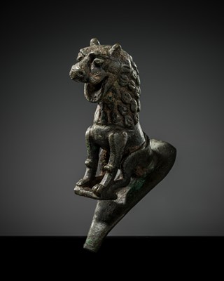 Lot 115 - A KHORASAN BRONZE ‘LION’ SPOUT, 12TH-13Th CENTURY