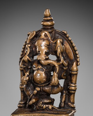 Lot 626 - A SILVER-INLAID BRONZE FIGURE OF GANESHA, CIRCA 12TH-14TH CENTURY