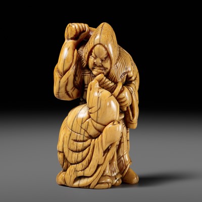 Lot 60 - AN OLD IVORY NETSUKE OF YASAKU AND HAKUZOSU