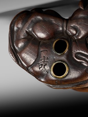 Lot 225 - ISSAI: A FINE WOOD NETSUKE OF FUJIN WITH HIS WIND BAG