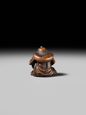 Lot 225 - ISSAI: A FINE WOOD NETSUKE OF FUJIN WITH HIS WIND BAG