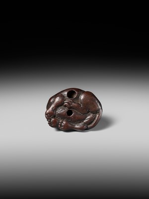 A SUPERB WOOD NETSUKE OF A RECUMBENT TIGER, ATTRIBUTED TO TAMETAKA