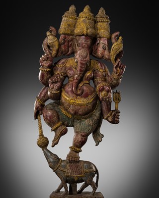 Lot 321 - A LARGE POLYCHROME WOOD FIGURE OF GANESHA DANCING ATOP HIS RAT