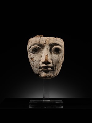 Lot 16 - AN EGYPTIAN GESSO PAINTED WOOD SARCOPHAGUS MASK, LATE PERIOD, 664-332 BC