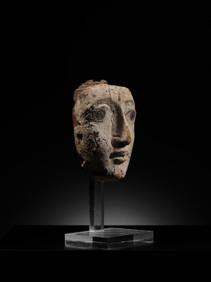 Lot 16 - AN EGYPTIAN GESSO PAINTED WOOD SARCOPHAGUS MASK, LATE PERIOD, 664-332 BC