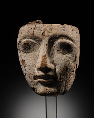 Lot 16 - AN EGYPTIAN GESSO PAINTED WOOD SARCOPHAGUS MASK, LATE PERIOD, 664-332 BC