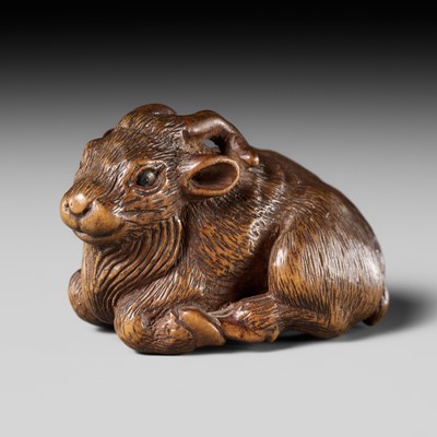 Lot 506 - MINKO: A FINE WOOD NETSUKE OF A RECUMBENT GOAT