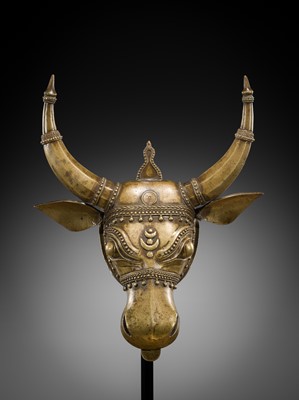 Lot 638 - A BHUTA CULT BRONZE MASK OF NANDI, KARNATAKA, 18TH-19TH CENTURY