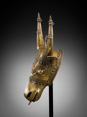 Lot 638 - A BHUTA CULT BRONZE MASK OF NANDI, KARNATAKA, 18TH-19TH CENTURY
