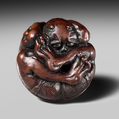 Lot 464 - SHOYUSAI HISAKAZU: A FINE NAGOYA SCHOOL WOOD NETSUKE OF A COWERING ONI DURING SETSUBUN