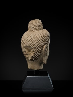 A FINE LIMESTONE HEAD OF BUDDHA, LATE NORTHERN WEI DYNASTY, 6TH CENTURY