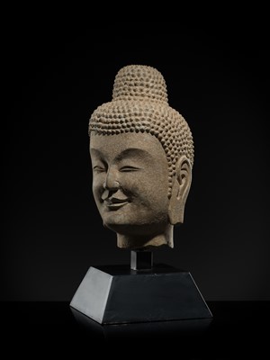 A FINE LIMESTONE HEAD OF BUDDHA, LATE NORTHERN WEI DYNASTY, 6TH CENTURY