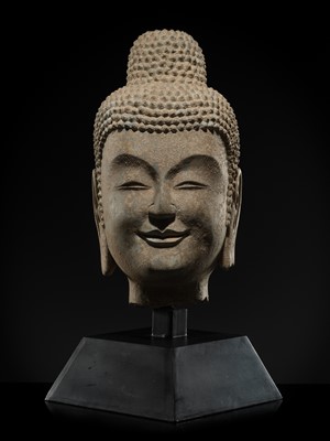 A FINE LIMESTONE HEAD OF BUDDHA, LATE NORTHERN WEI DYNASTY, 6TH CENTURY