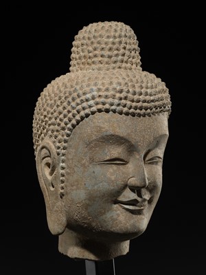 A FINE LIMESTONE HEAD OF BUDDHA, LATE NORTHERN WEI DYNASTY, 6TH CENTURY