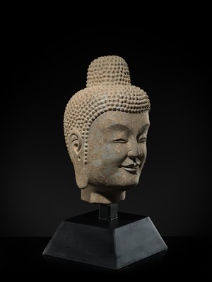 A FINE LIMESTONE HEAD OF BUDDHA, LATE NORTHERN WEI DYNASTY, 6TH CENTURY