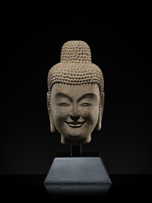 A FINE LIMESTONE HEAD OF BUDDHA, LATE NORTHERN WEI DYNASTY, 6TH CENTURY