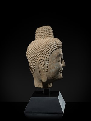 A FINE LIMESTONE HEAD OF BUDDHA, LATE NORTHERN WEI DYNASTY, 6TH CENTURY
