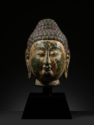 Lot 50 - A RARE AND MAGNIFICENT GILT GREEN MARBLE HEAD OF BUDDHA, NORTHERN QI DYNASTY, 550-577