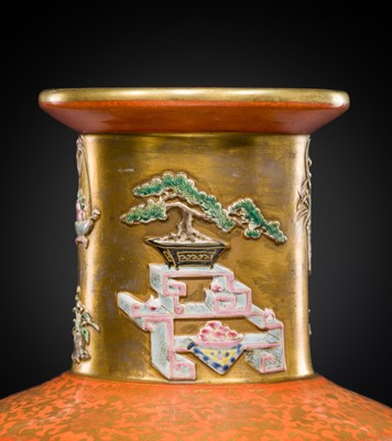 A RELIEF-DECORATED ‘HUNDRED TREASURES’ FAMILLE-ROSE VASE, LATE QING DYNASTY TO REPUBLIC PERIOD