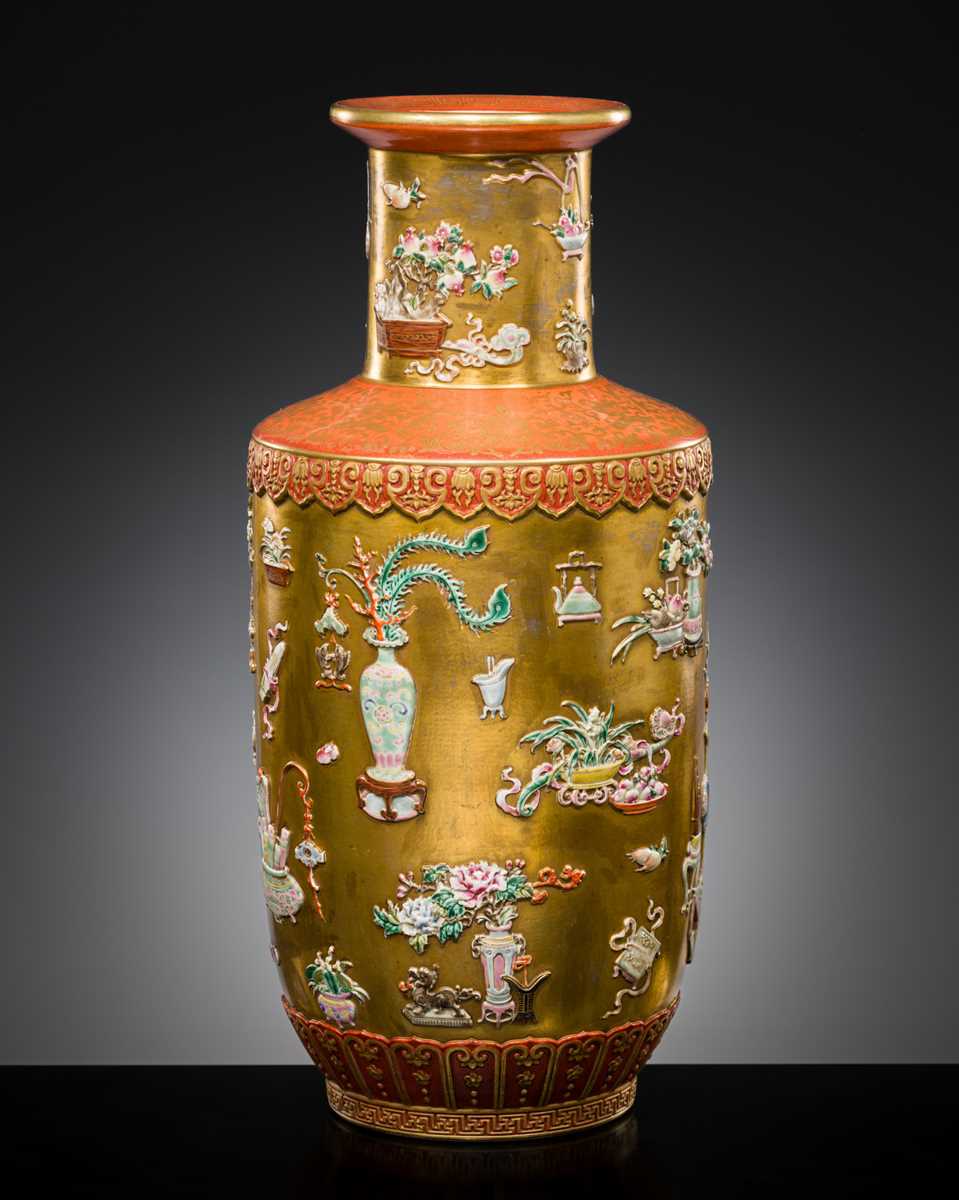A RELIEF-DECORATED ‘HUNDRED TREASURES’ FAMILLE-ROSE VASE, LATE QING DYNASTY TO REPUBLIC PERIOD