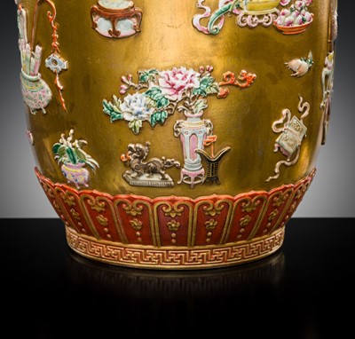 A RELIEF-DECORATED ‘HUNDRED TREASURES’ FAMILLE-ROSE VASE, LATE QING DYNASTY TO REPUBLIC PERIOD