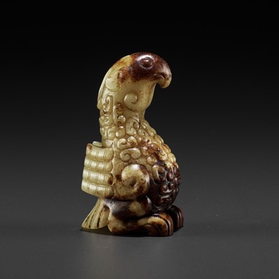 Lot 436 - A YELLOW AND RUSSET JADE FIGURE OF A PHOENIX, SPRING AND AUTUMN PERIOD