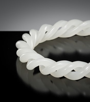 Lot 465 - A WHITE JADE ROPE-TWIST BANGLE, QING DYNASTY