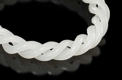Lot 465 - A WHITE JADE ROPE-TWIST BANGLE, QING DYNASTY