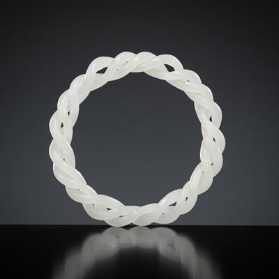 Lot 465 - A WHITE JADE ROPE-TWIST BANGLE, QING DYNASTY