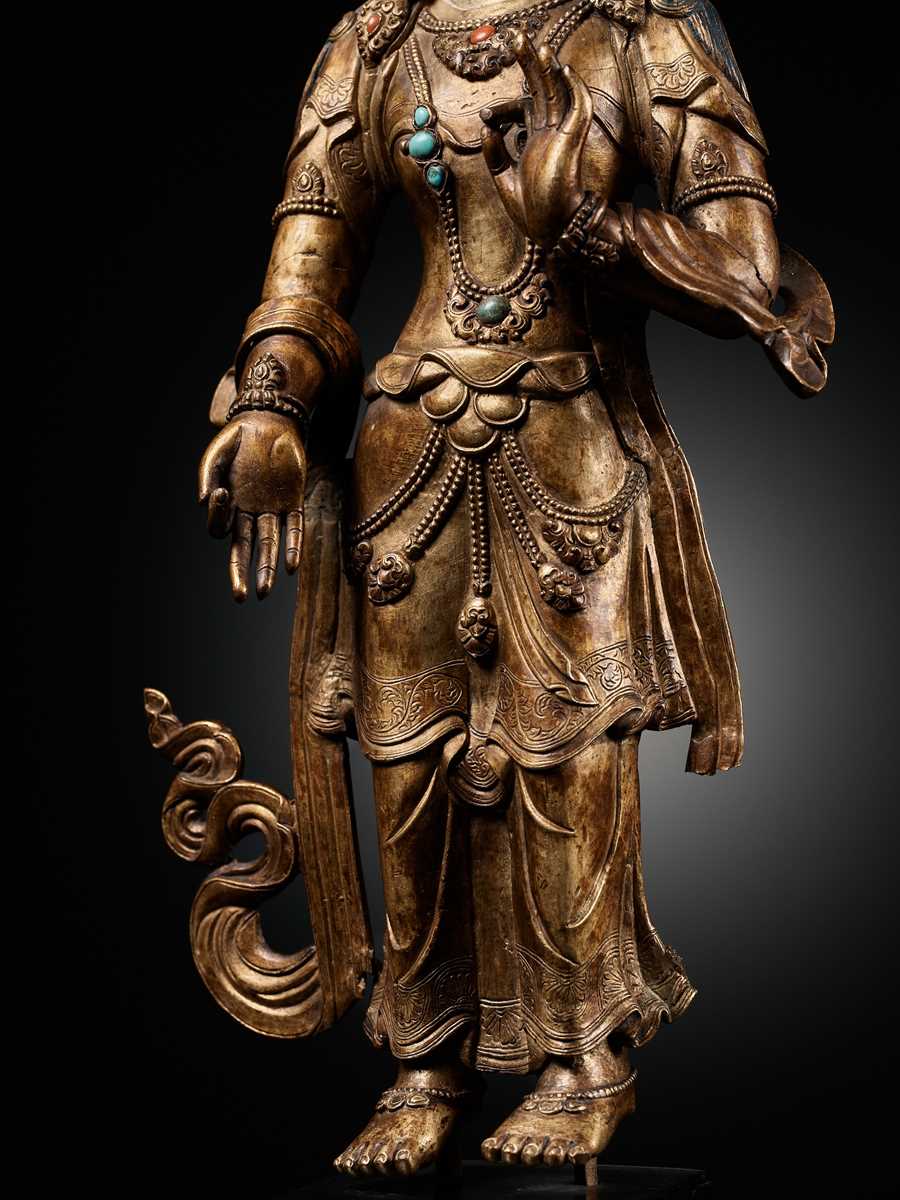 Lot 24 A GILT BRONZE FIGURE OF AVALOKITESHVARA,