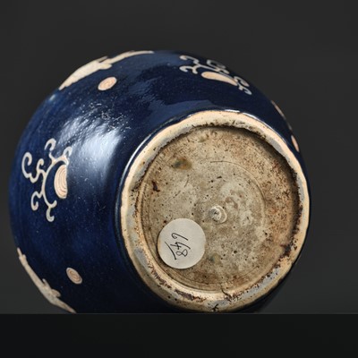 Lot 151 - A BLUE-GLAZED CARVED ‘FISH’ BALUSTER JAR, JIAJING PERIOD, 1521-1567