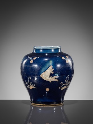Lot 151 - A BLUE-GLAZED CARVED ‘FISH’ BALUSTER JAR, JIAJING PERIOD, 1521-1567