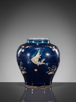 Lot 151 - A BLUE-GLAZED CARVED ‘FISH’ BALUSTER JAR, JIAJING PERIOD, 1521-1567