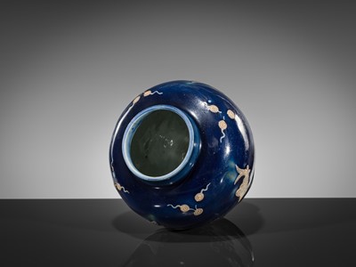 Lot 151 - A BLUE-GLAZED CARVED ‘FISH’ BALUSTER JAR, JIAJING PERIOD, 1521-1567