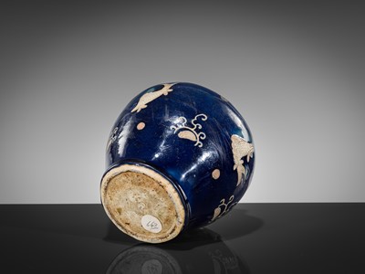 Lot 151 - A BLUE-GLAZED CARVED ‘FISH’ BALUSTER JAR, JIAJING PERIOD, 1521-1567